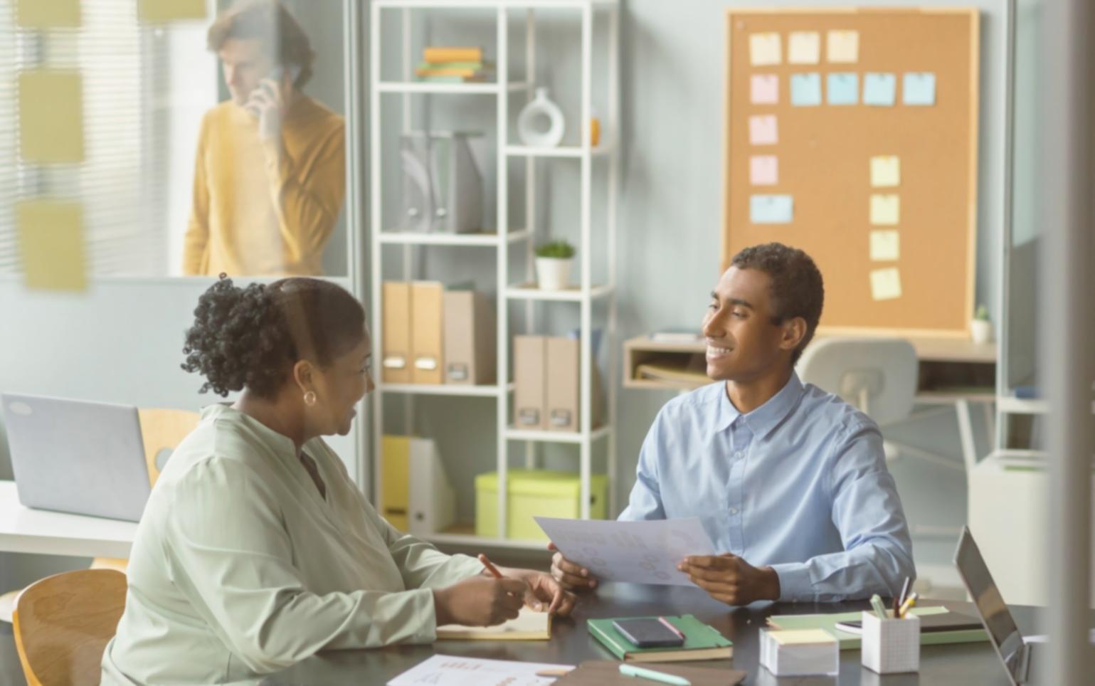 Professional workspace showing career development materials and planning documents